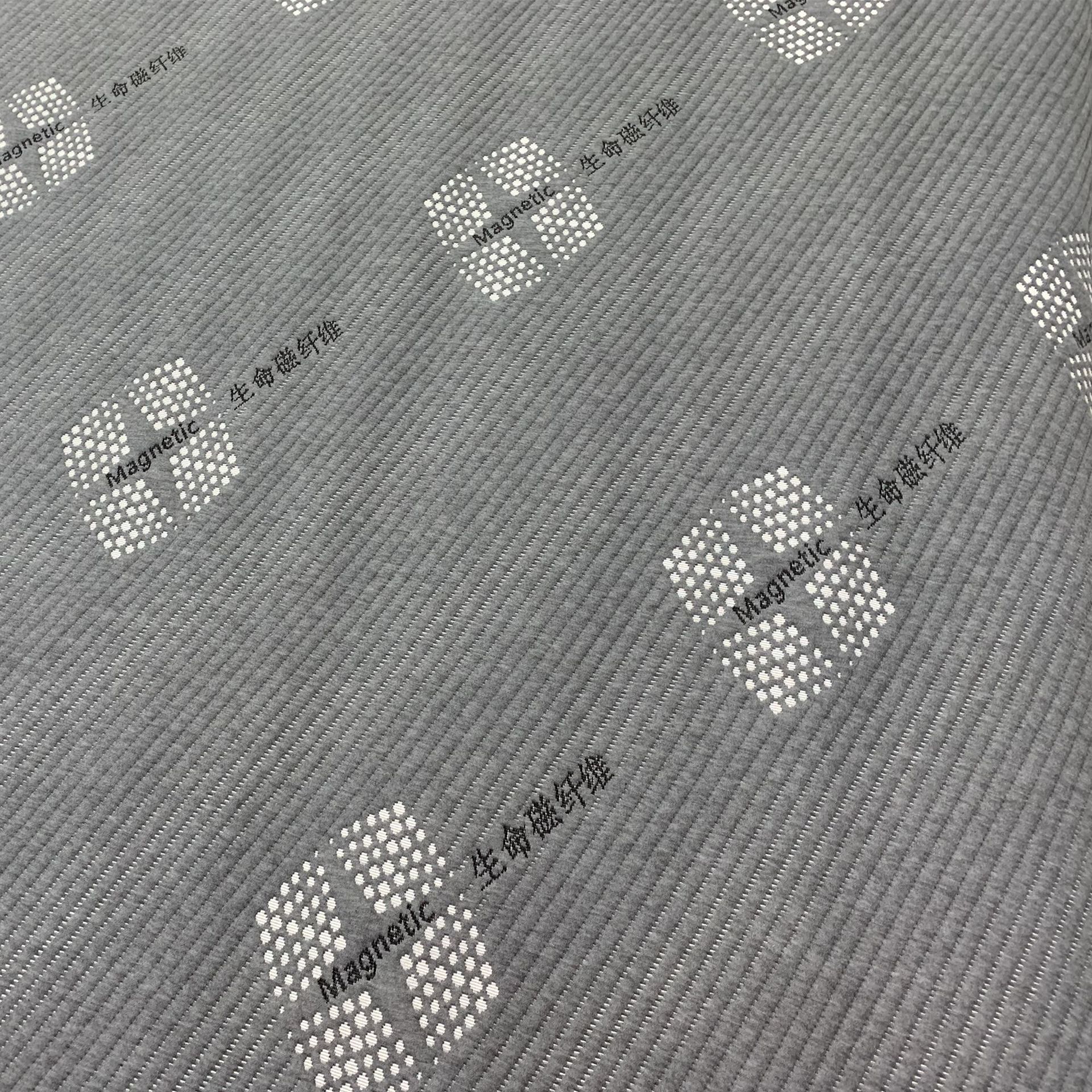 Los fabricantes suministran 180g de tela de colchón gris cáñamo con tela funcional de colchón jacquard de punto de fibra magnética de vida