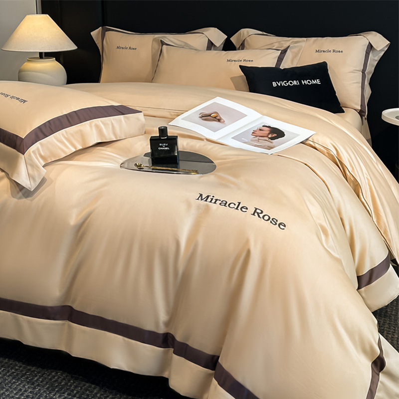 Cama de algodón de lujo ligero de alta gama de cuatro piezas de algodón 2025 nueva ropa de cama de tres piezas con funda de edredón de alta calidad