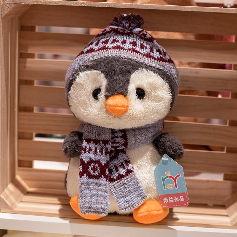 Bonitos pingüinos juguetes de peluche bufandas de invierno muñecas de dibujos animados niños mochilas agarrar muñecas al por mayor muñecas noreste