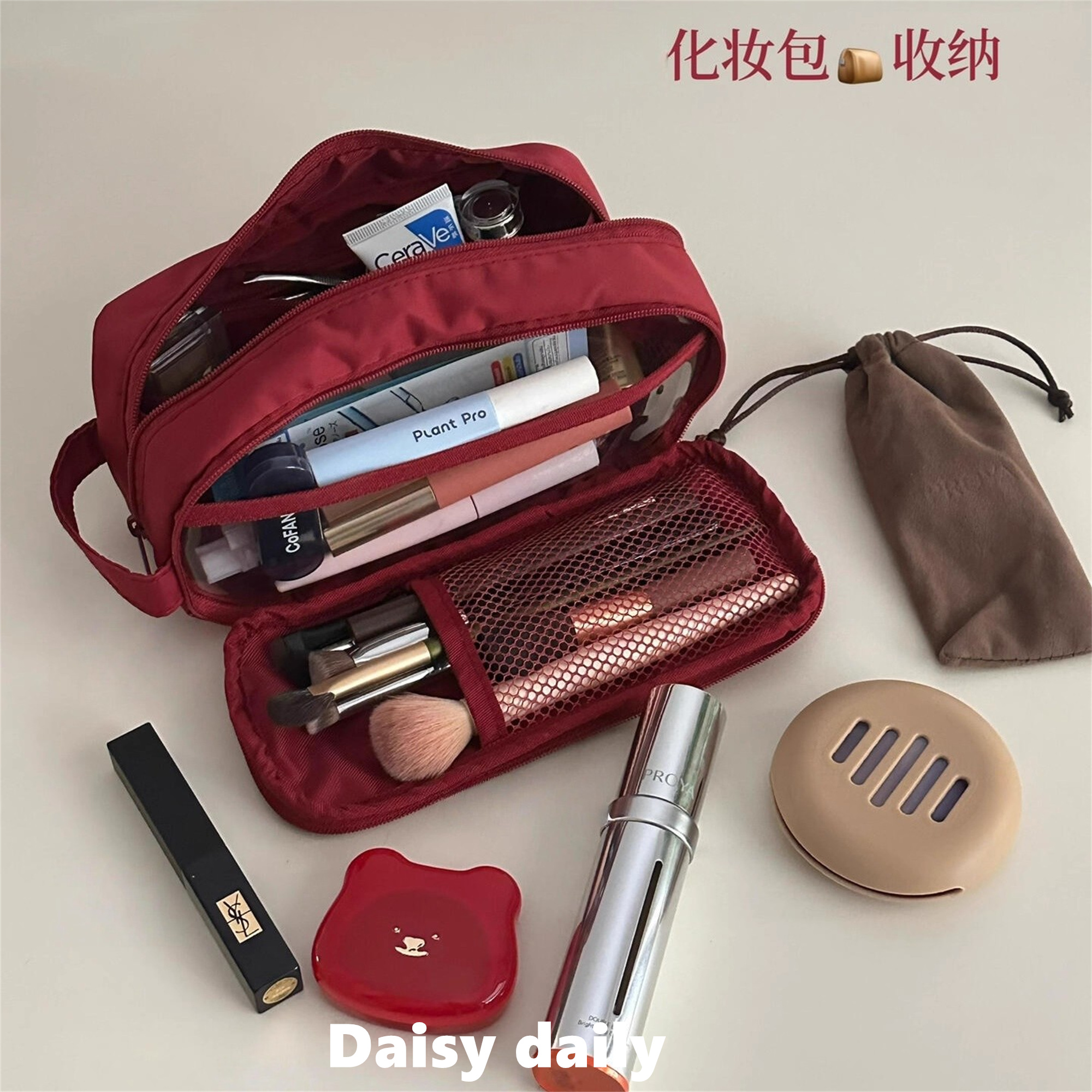 Capacious handheld cosmetic bag