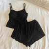 Black shorts, top with cups, lifting effect