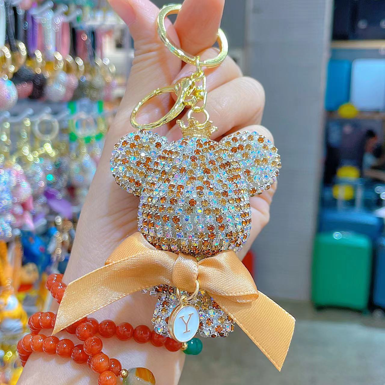 Venta directa de fábrica de lujo completo diamante muñeca llavero pajarita cabeza grande oso completo diamante bolsa colgante coche llavero