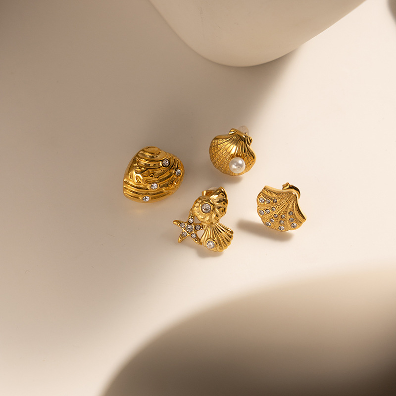 Taena Pendientes de acero de titanio chapado en oro de 18k europeos y americanos Pendientes de circonio con incrustaciones de estilo de playa de concha de alta calidad