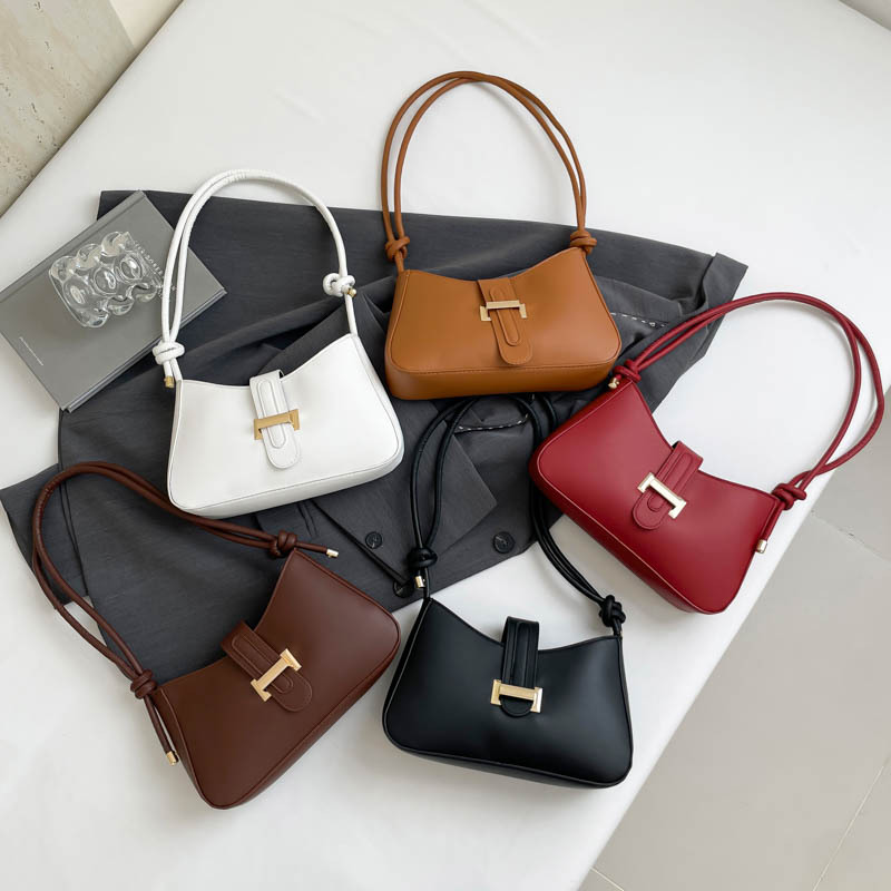 Bolsas de hombro para mujeres 2025 primavera nuevo cinturón de cinturón nuevo bolso de brazo de mujer simple bolso de hombro de mujer