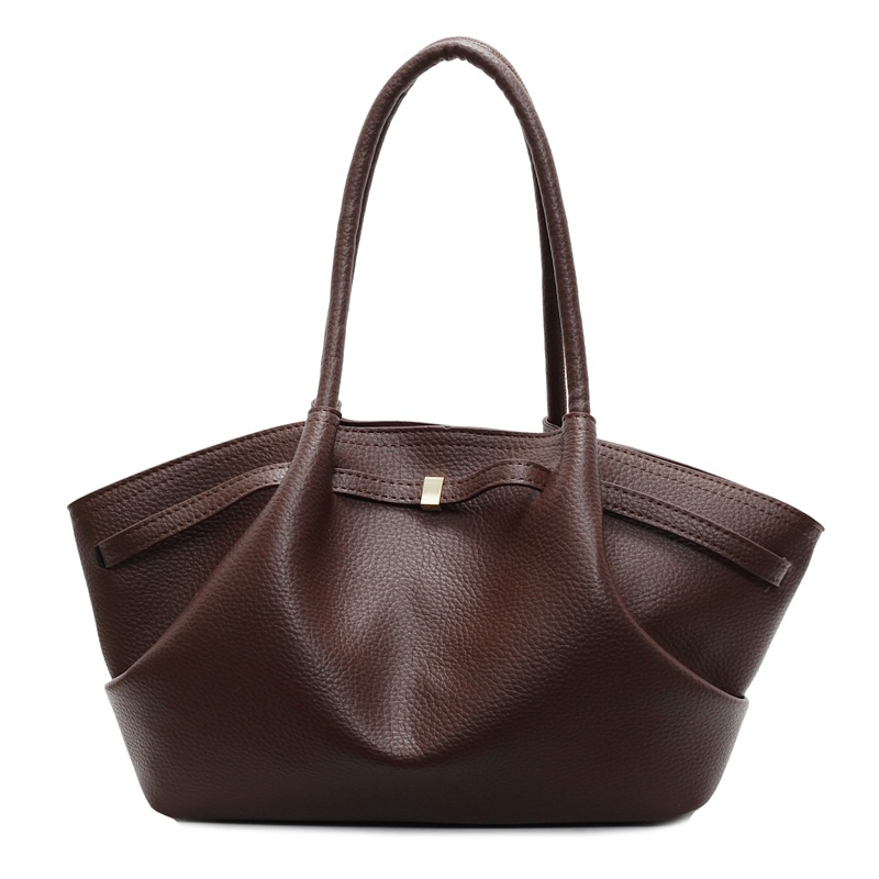 Nicho de diseño de bolsas de cubo de mano para mujeres 2025 nuevo estilo de moda de hombro bolsas de viaje de estilo retro bolsas de brazo