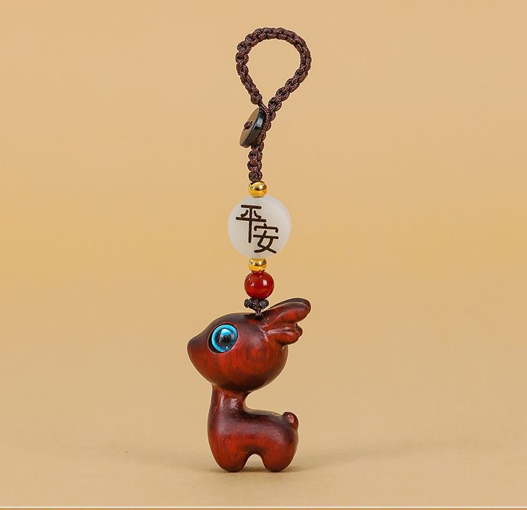A deer car key chain pendant sandalwood deer buckle key car decoration deer couple pendant