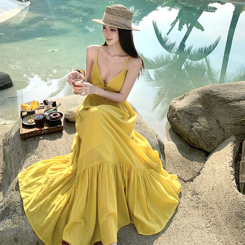 2026 Summer Vacation Style Mango Yellow Backless Spaghetti Strap Dress with Built-In Chest Pads, Perfect for Sanya Travel, Super Fairy-Like Long Dress 2026 Summer Vacation Style Mango Yellow Backless Spaghetti Strap Dress with Built-In Chest Pads, Perfect for Sanya Travel, Super Fairy-Like Long Dress