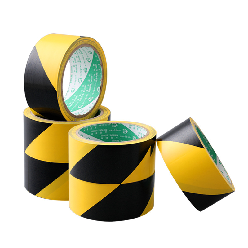 Cintas de advertencia amarillas negras de PVC pegadas en el suelo zebra crossing señales de advertencia de seguridad pegadas en la decoración de la línea de aislamiento de la cinta adhesiva