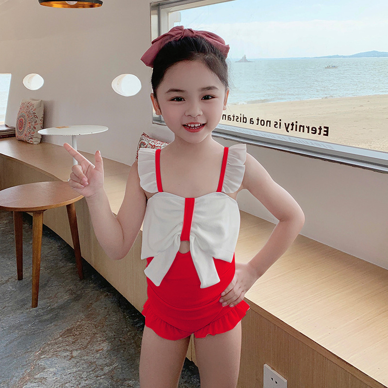 Traje de baño para niñas de una pieza estilo coreano lindo arco traje de baño para niños pequeño traje de baño de vacaciones de primavera caliente fresca al por mayor