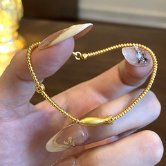 小紅の本の爆発の小さい黄色の魚のブレスレットのファッションの高級品の秋冬の百合の金色の玉の数珠の手の串の代行