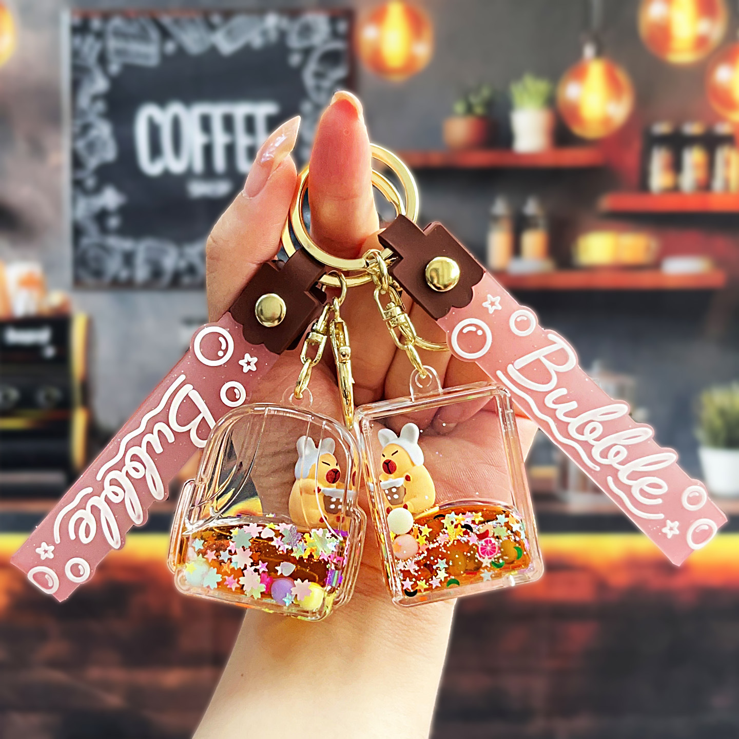 Nuevo aceitoso arena movediza taza de té con leche llavero colgante lindo divertido Kapibala llavero flotante pequeño regalo al por mayor