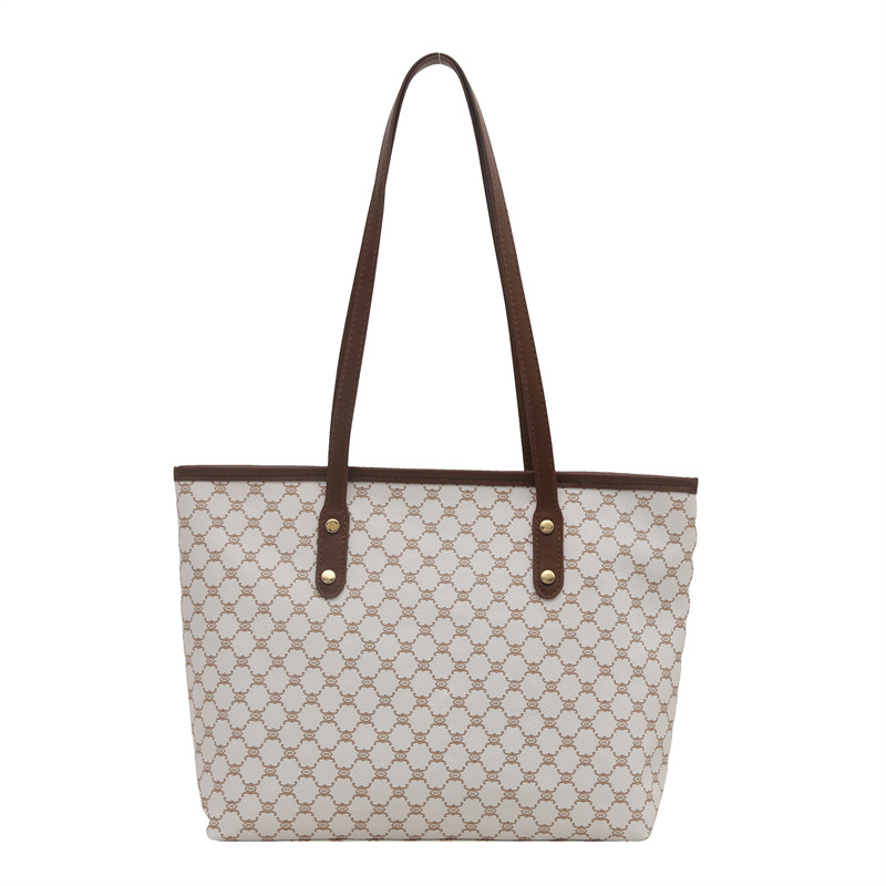 Bolso Tote personalizado de paso relajado de gran capacidad 2025 nuevo hermoso bolso de hombro de moda de nicho con textura bolso femenino