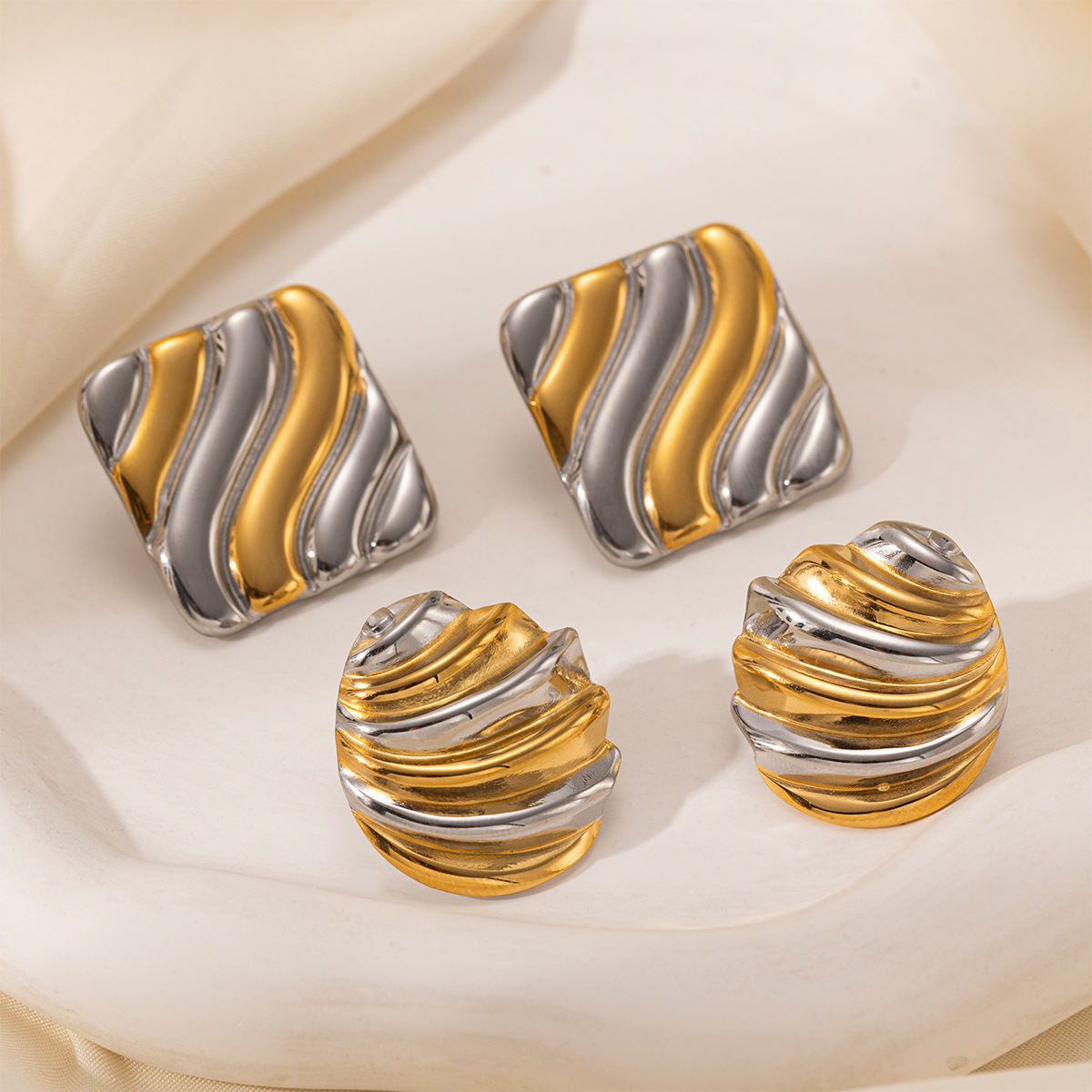 Taina auriculares de acero inoxidable lujosos de alto nivel, geometría minimalista, acero de titanio corrugado no se desvanece, auriculares transfronterizos europeos y estadounidenses