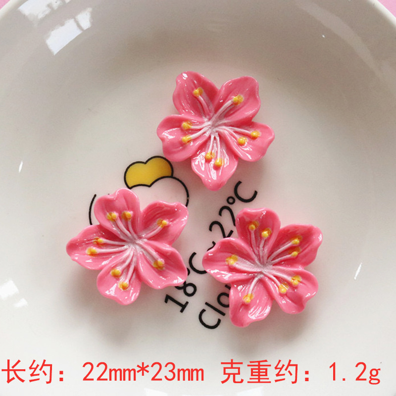 Nuevos accesorios de bricolaje de flor de durazno de resina rosa, zapatos con agujeros de pegamento de crema, fundas para teléfonos móviles, accesorios para el cabello, material de imán para refrigerador al por mayor
