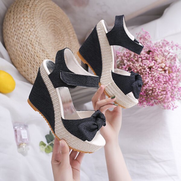Summer fashionable cute sandals with a strap with bow wedge heel…
