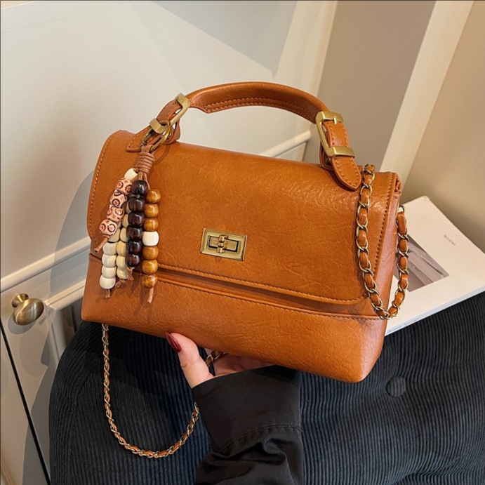 Cross-border 2025 otoño y invierno nuevo bolso de mano de alta calidad bolso cuadrado pequeño de textura de mujer bolso de hombro nicho bolso de mochila