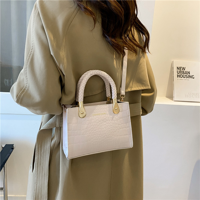 Bolsa de moda con textura para mujer 2024 estilo coreano estilo occidental nuevo color caramelo patrón de piedra bolso tejido bolsa de mensajero