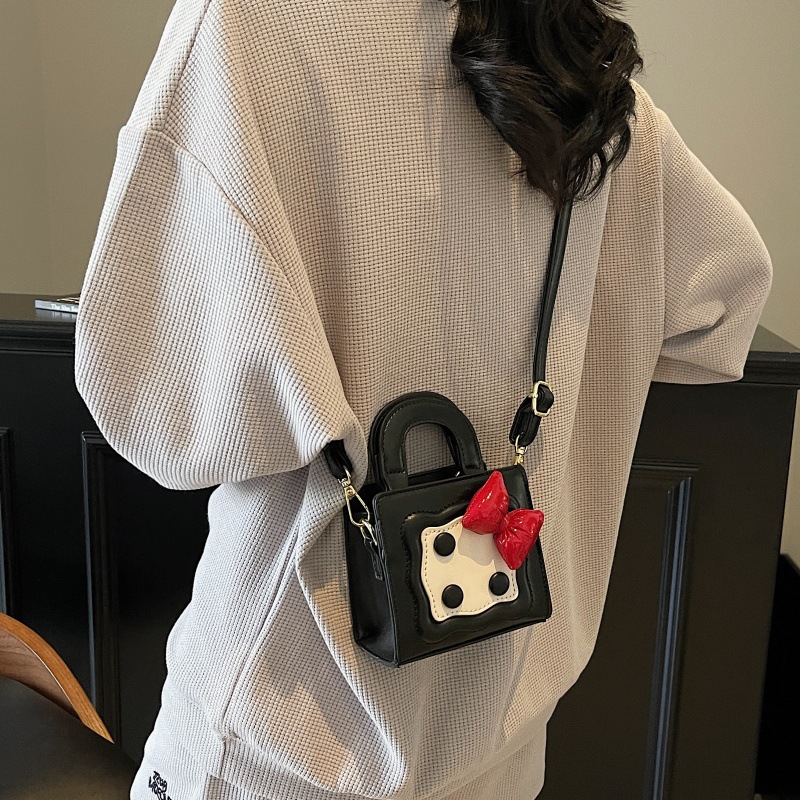 Bolso lindo japonés 2025 primavera nuevo bolso femenino lazo en contraste bolso de hombro mini bolso de mensajero para niños