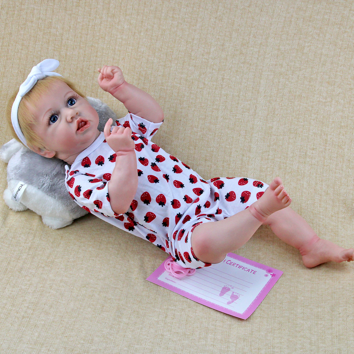 Ia suave pesado comercio electrónico bebé 22 pulgadas venta al por mayor muñecas juveniles calientes juguetes de goma de acero muñecas rubias