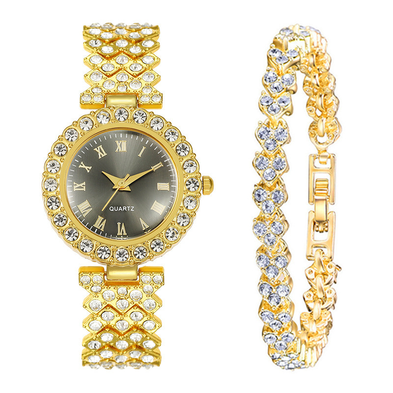 Gold and black roman + bracelet