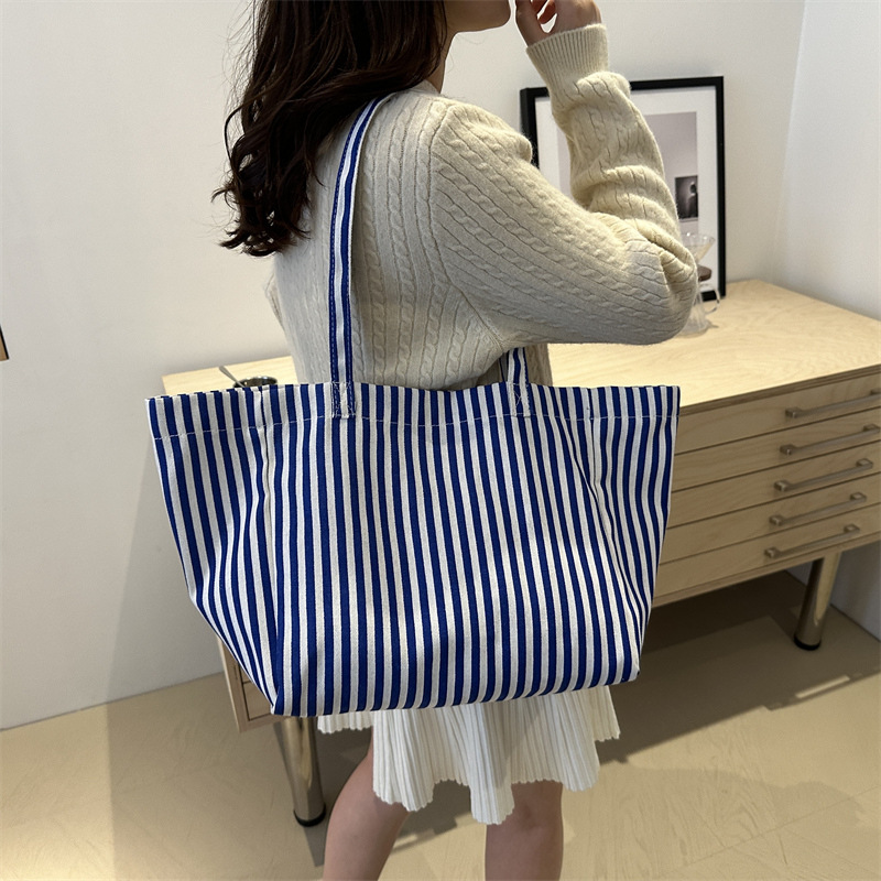 Bolsas de lona a rayas de otoño de mujeres bolsas 2024 nuevas bolsas de mano populares bolsas de hombro casuales de gran capacidad bolsas tote