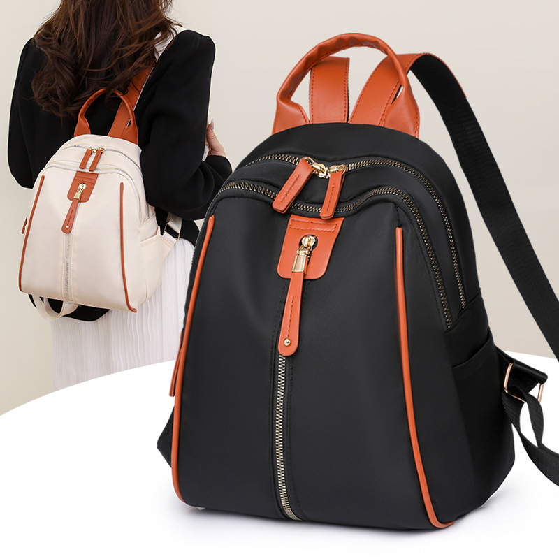 Mochila de nailon para mujer 2024 nueva moda anti-salpicaduras para mujer mochila de concha estilo occidental bolso de viaje de ocio