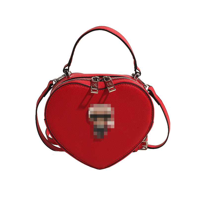 Bolsos transfronterizos para mujer 2024 nuevo bolso de hombro con diseño de corazón de nicho de moda bolso de mensajero portátil de amor de alta gama