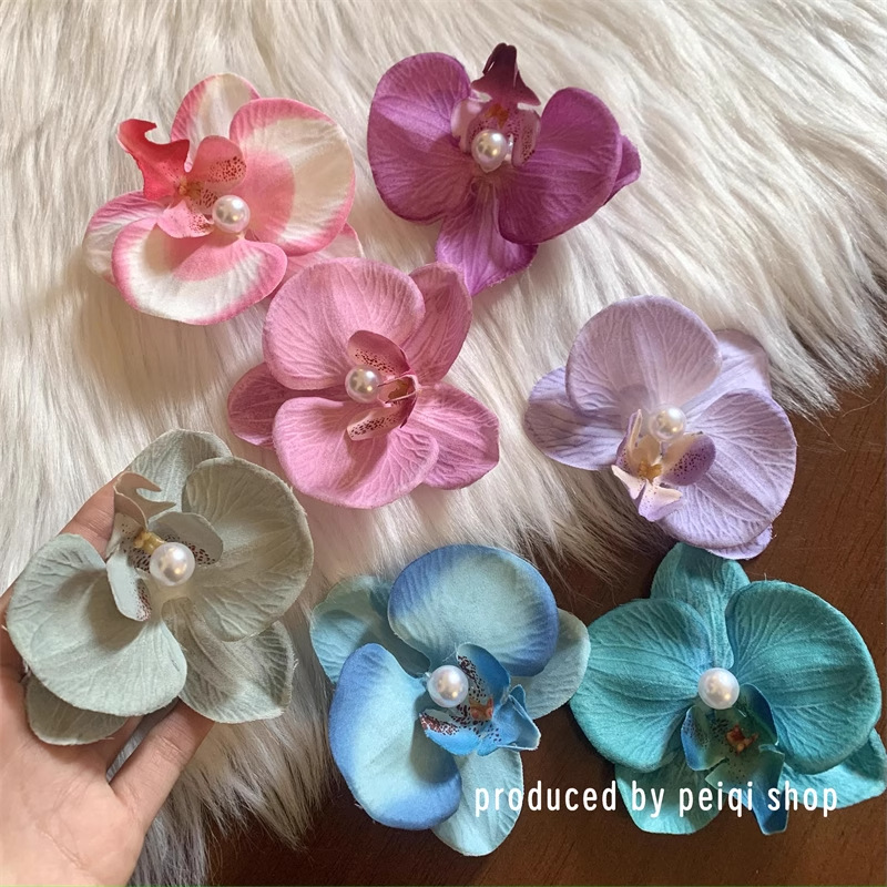 Puramente deseoso de viento colorido primavera orquídea mariposa broca de flores laterales flores simuladas tocado de flores al por mayor acrobacias para el pelo de viajes al mar
