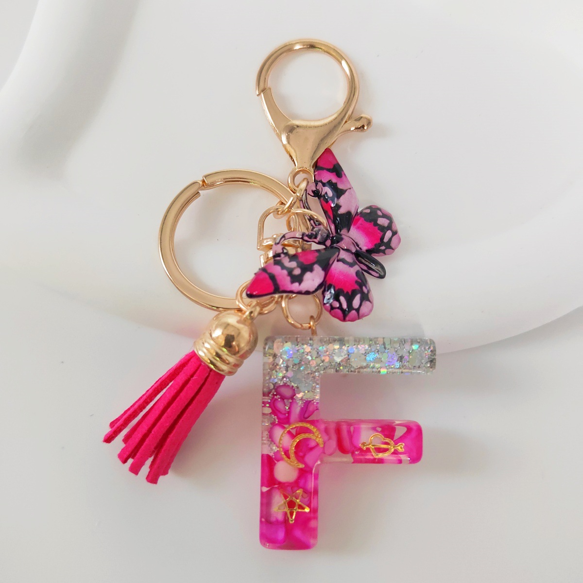 Inventario transfronterizo nueva resina bicolor mariposa borda llavero colgante estrella luna accesorios de joyas