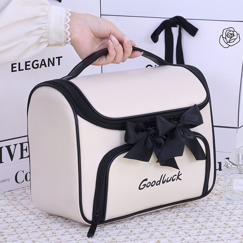 Luz lujosa pequeña fragancia arco bolsa de maquillaje mujer gran capacidad de viaje portátil división impermeable bolsa de almacenamiento de lavado de alto nivel