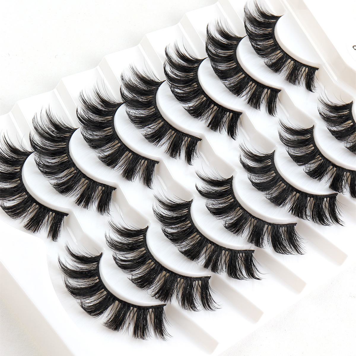 Fábrica al por mayor 7 pares de parillas de visón multicapa densa par de par de pelo desordenado par de parillas falsas cruzadas