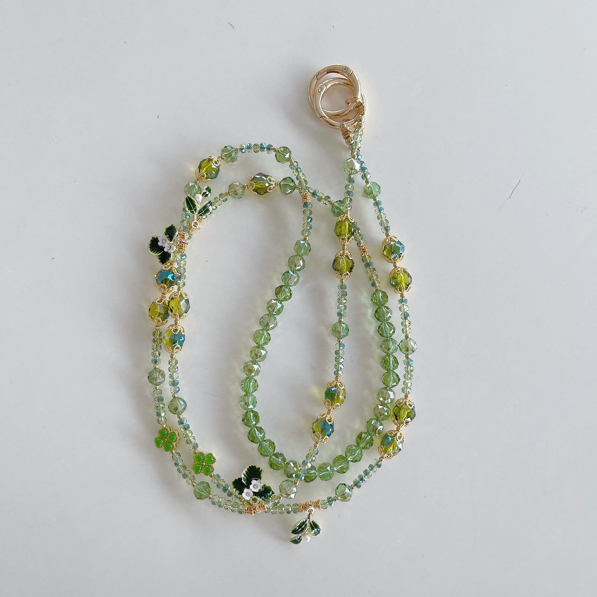 Boutique hecho a mano de alta gama para teléfono móvil cadena larga de hoja verde de aleación cordón de teléfono móvil de moda colgante de mensajero largo