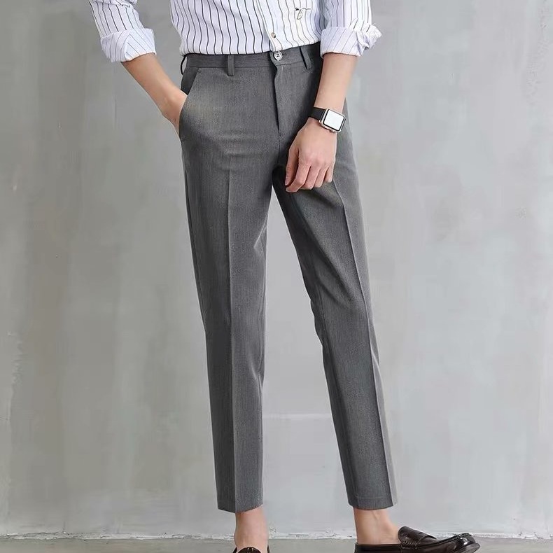 Los fabricantes de origen pantalones pequeños negros pantalones cortos para hombres, pantalones de traje ajustados rectos con sentido de tendencia, pies pequeños, versión coreana casual