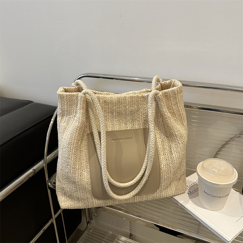 Popular bolsa de tejido de gran capacidad para mujeres 2024 verano nueva bolsa de hombro universal bolsa de viaje de moda