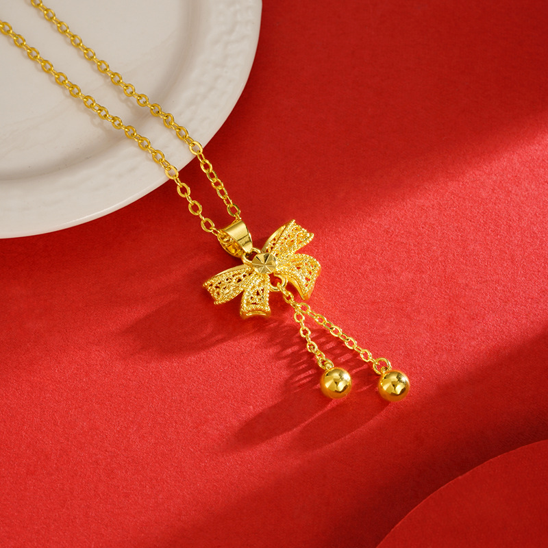 Princesa arco colgante dulce moda todo-fósforo de las mujeres en línea rojo caliente borla DIY arena oro collar Accesorios