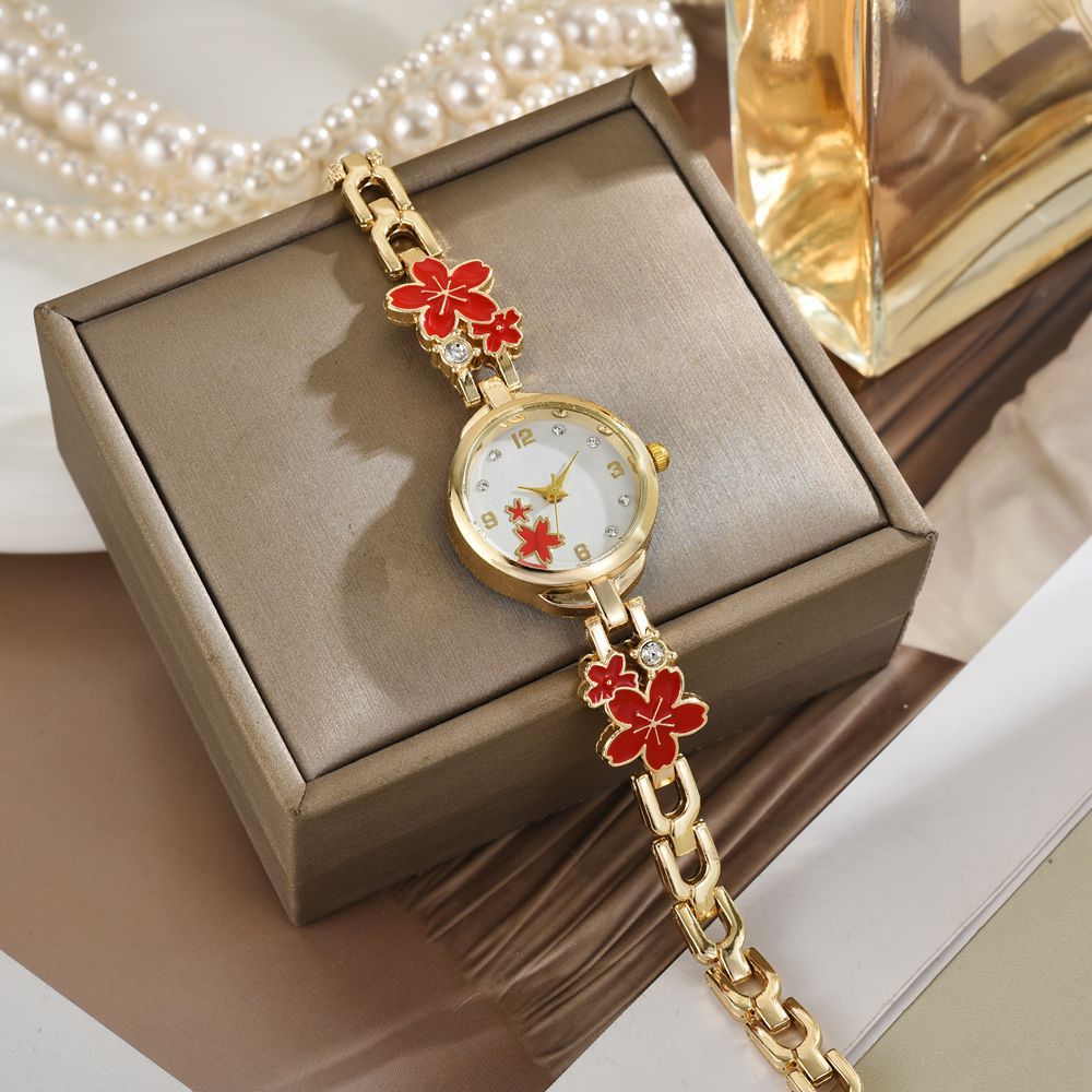 Los nuevos ins exquisitos y versátiles, temperamento compacto, lujo ligero, tendencia de la moda, esfera de cinco flores pequeñas, pulsera, reloj femenino