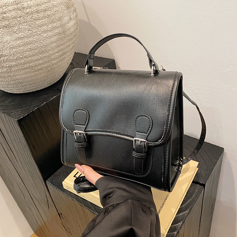 Colegio retro coreano doble hebilla estilo británico 2024 literatura y arte ocio de gran capacidad de moda textura mochila de hombro