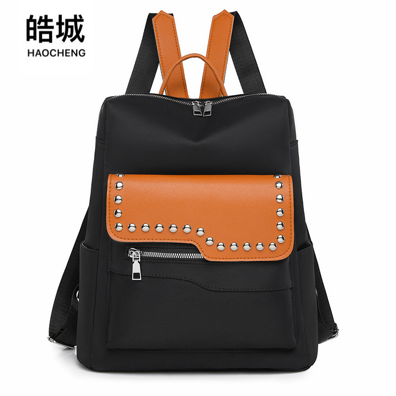 Nueva mochila con remaches para mujer de color en contraste, mochila de viaje simple y versátil de gran capacidad, mochila de viaje al aire libre, al por mayor