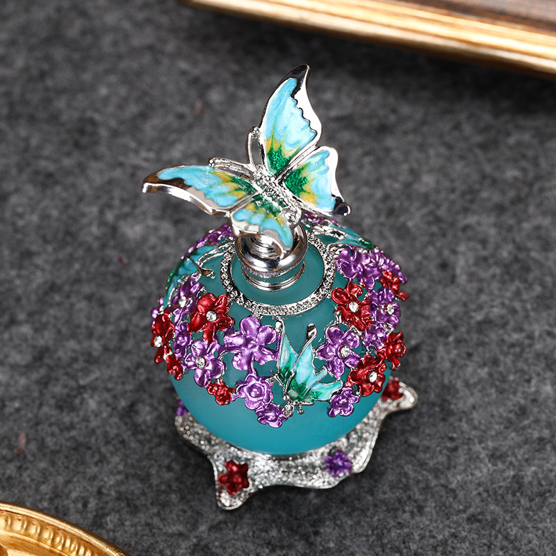 AliExpress Venta caliente mariposa 20ml botella de aceite de gran capacidad sub-embotellado botella de perfume de aleación de zinc botella de decoración al por mayor