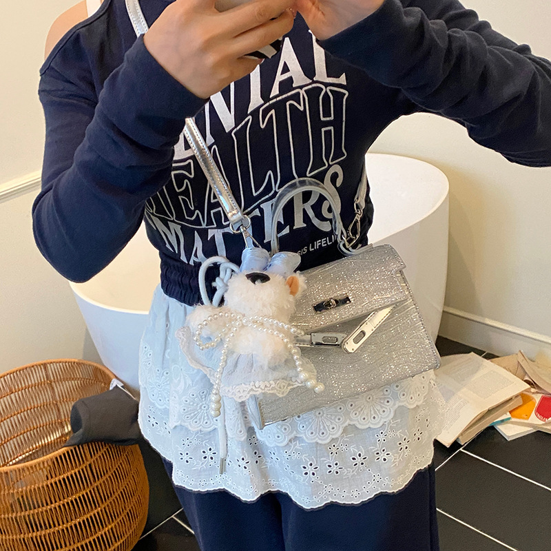 Bolso Kelly portátil de alta gama de moda transfronteriza para mujer 2025 nuevo estilo salvaje estilo occidental color sólido bolso de mensajero casual de un solo hombro