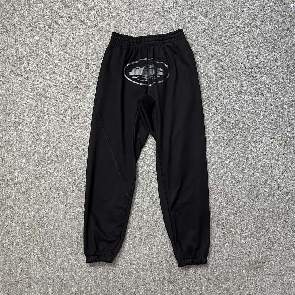 Versión alta de moda de terciopelo con chaqueta encapuchada, pantalones casuales, nuevos pantalones de otoño y invierno para hombres