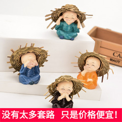 A cartoon monk with a straw hat car model, car interior ornament, cute and not small, Sariputra car interior decoration