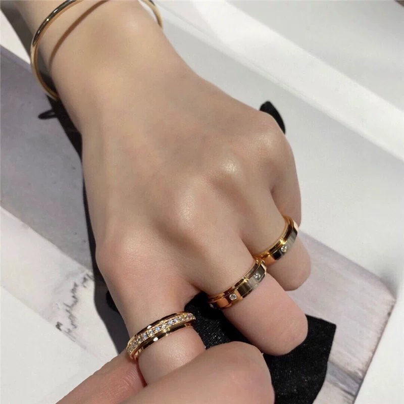 Кольцо V золото, позолота розовым золотом 18K и варианты из серебра, вращающийся круг с бриллиантом, один камень или 7 камней (размеры 5–10)