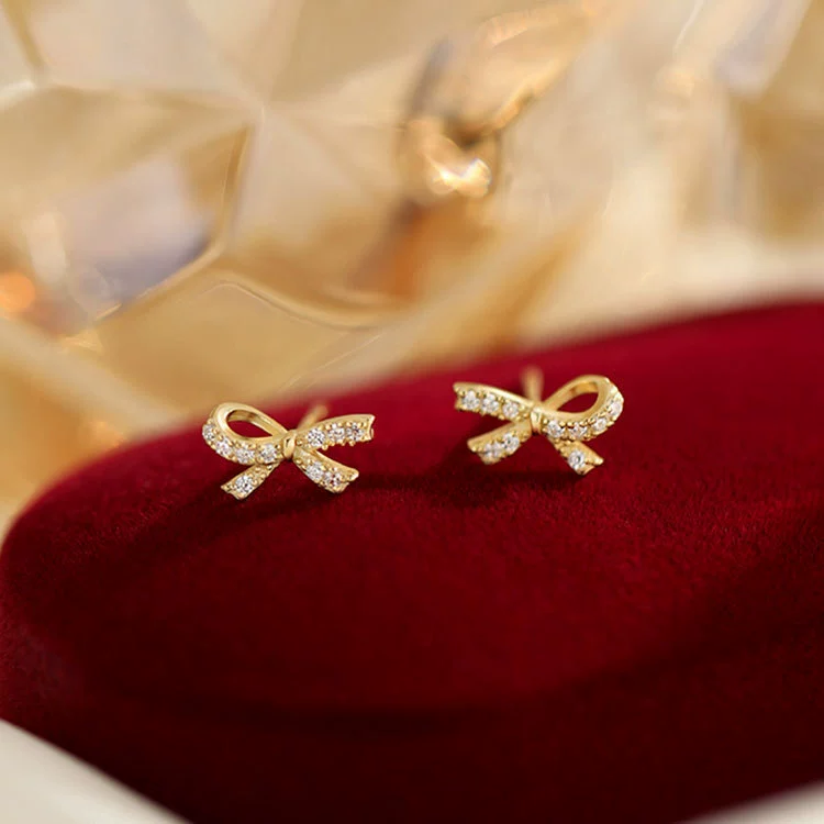 Brand earrings with zircon with bow, silver 925 sample
