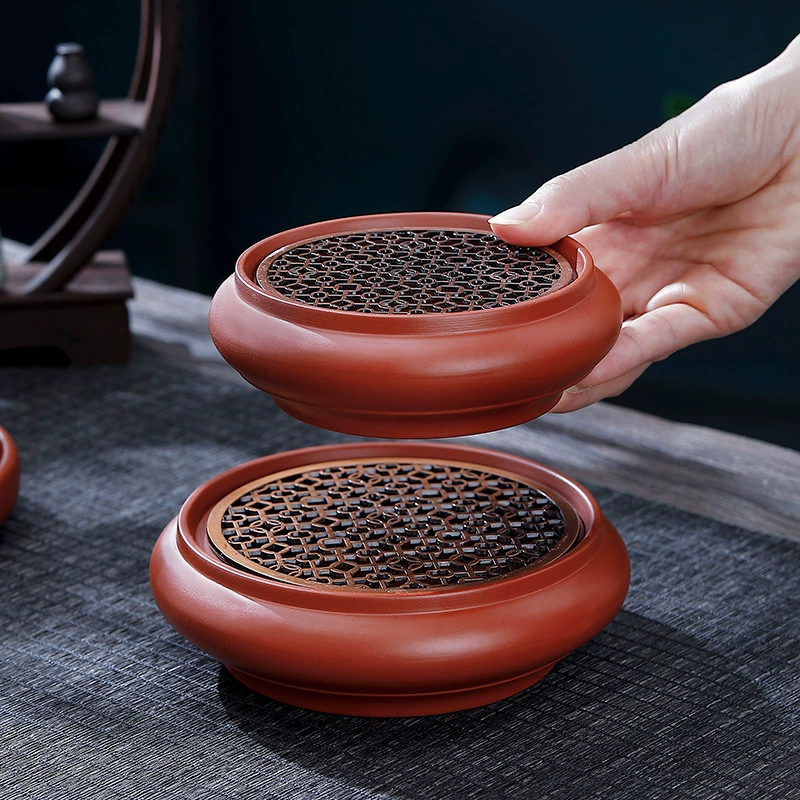 Чжу Ни тянет барабанный горшок с сухим чайным лотком