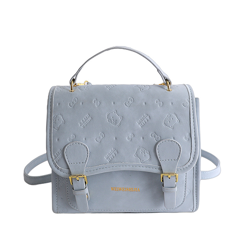 Mochila retro estilo universitario de doble hebilla 2026 nueva moda diaria sensación de bolso de viaje mochila en relieve