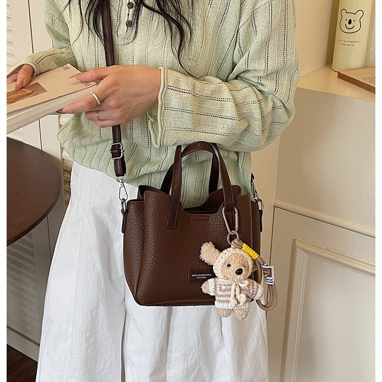 Bolso de cubo popular coreano para mujeres 2026 primavera nuevo nicho Zhong tote bag de alta calidad mochila de viaje