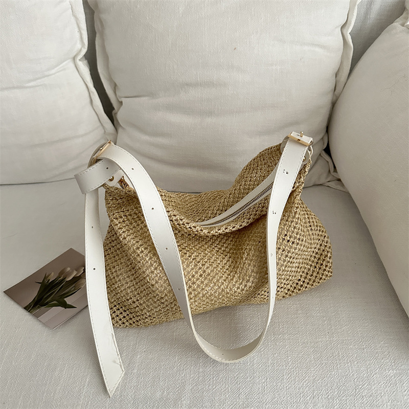 Nicho de alta sensación de bolso de tejido para mujeres 2024 nuevo tipo de viaje al trabajo bolso de paja de hombro de gran capacidad bolso de mochila