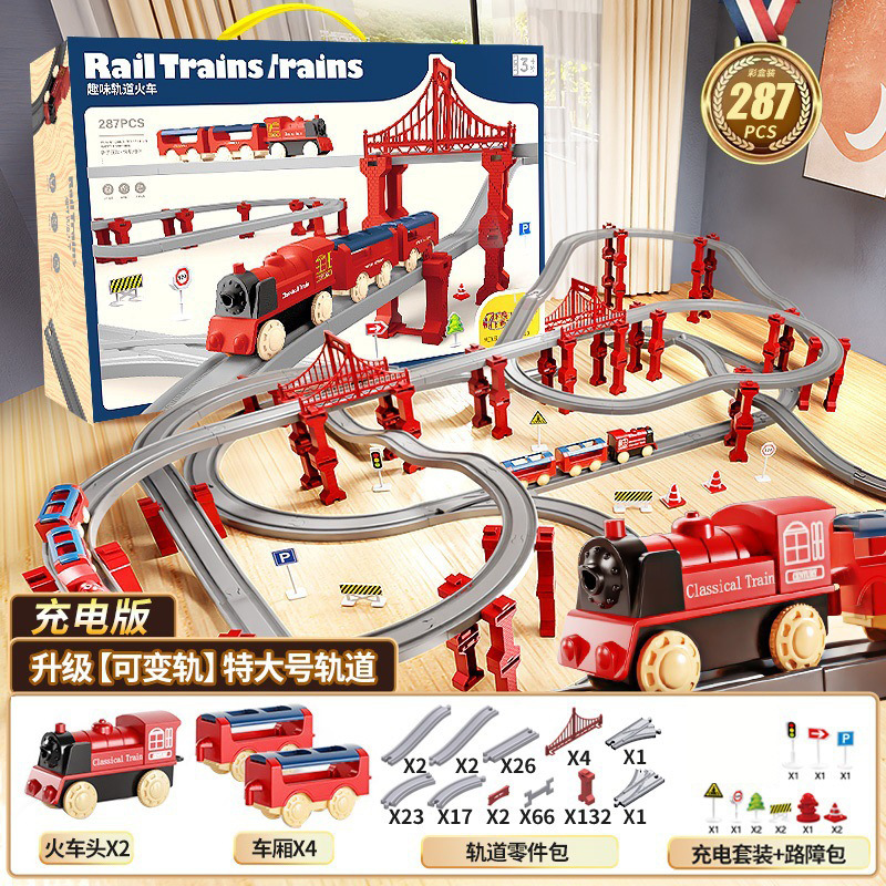 国境を越えた電気高速鉄道の電車は軌道を持っている男の女の子が模型を組んで車のおもちゃの誕生日プレゼントをシミュレートした