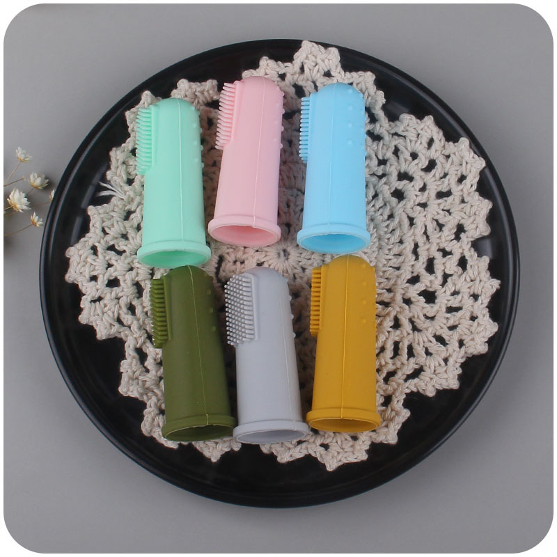 Nuevo bebé suministros de silicona dedo conjunto cepillo de dientes bebé pelo suave dedo cepillo de dientes creativo silicona teether Amazon
